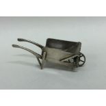 A Continental silver model of a wheelbarrow with o