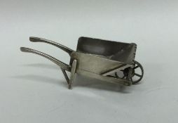 A Continental silver model of a wheelbarrow with o