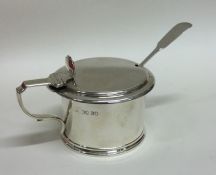 A good silver mustard pot with shell thumb piece.