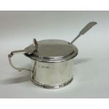 A good silver mustard pot with shell thumb piece.