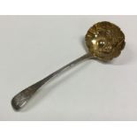 A George III silver berry ladle with gilt bowl. Lo