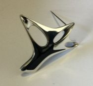 GEORG JENSEN. A heavy stylish silver brooch with e