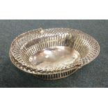 A large pierced George II silver basket on sweepin