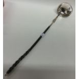 An 18th Century silver bright cut toddy ladle with