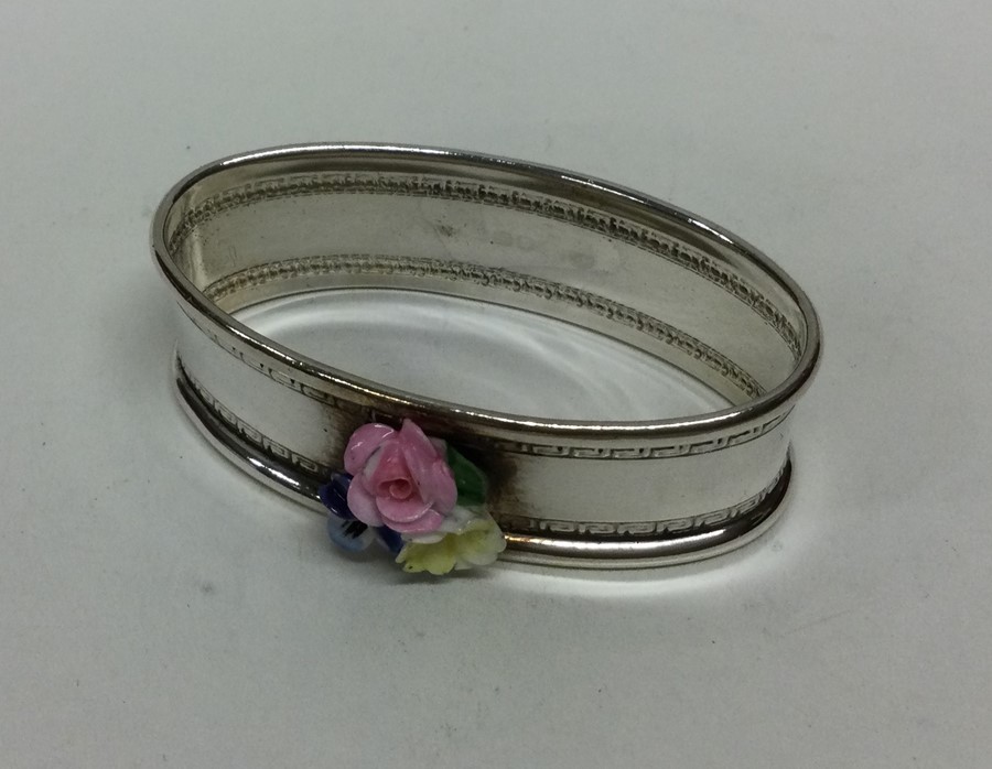 A silver and porcelain mounted napkin ring decorat - Image 2 of 3