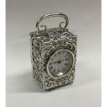 A good silver embossed carriage clock with scroll