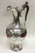 A large and impressive crested silver wine ewer at