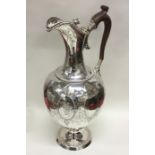 A large and impressive crested silver wine ewer at