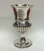 A George III silver half fluted goblet on spreadin