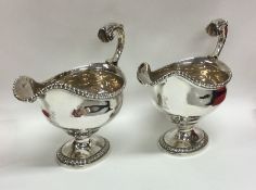 A good pair of Georgian silver sauce boats with ga