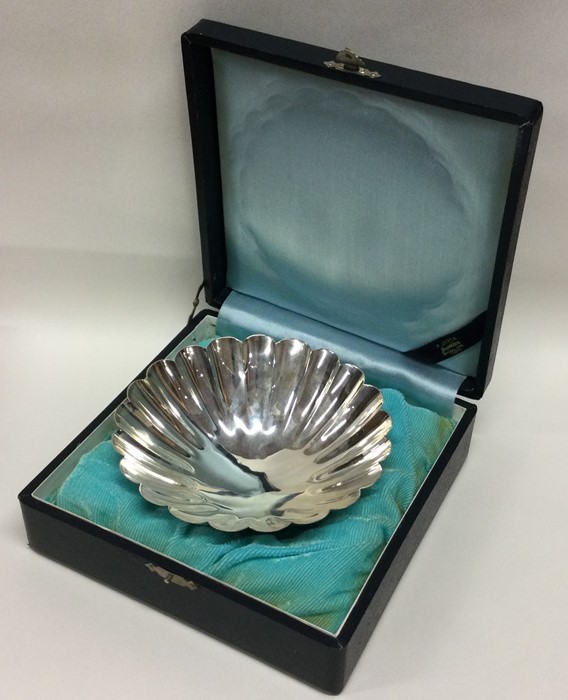 A large Japanese silver dish of shaped form. 950 s