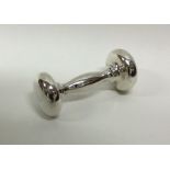 An American silver baby's rattle in the form of a