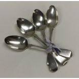 A group of four fiddle pattern silver dessert spoo