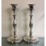 A good pair of Georgian silver candlesticks with f