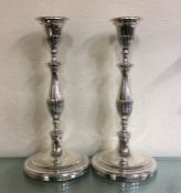 A good pair of Georgian silver candlesticks with f