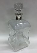 A silver mounted glass decanter. By Asprey & Co. E