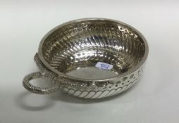 A large silver wine taster with serpent handle. Ci