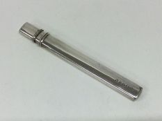 A large silver mounted pencil with lift-off cover.