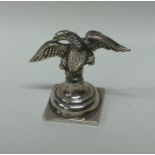 A novelty silver menu holder in the form of an eag