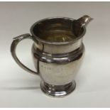 A heavy Edwardian silver cream jug. Birmingham. By