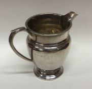 A heavy Edwardian silver cream jug. Birmingham. By