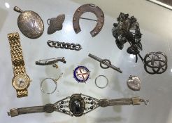 A bag containing good silver brooches, lockets etc