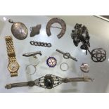 A bag containing good silver brooches, lockets etc