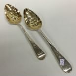 A good pair of George III silver berry spoons with