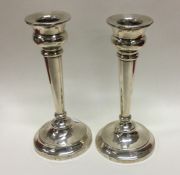 A pair of circular silver candlesticks. Birmingham