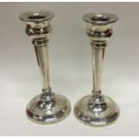 A pair of circular silver candlesticks. Birmingham