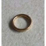 A plain 18ct gold wedding band. 4 grams. Est. £60