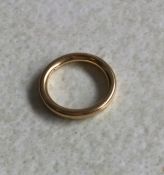 A plain 18ct gold wedding band. 4 grams. Est. £60