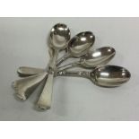 A set of four tapering silver teaspoons. London. A
