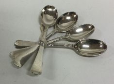 A set of four tapering silver teaspoons. London. A