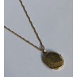 A lady's 9 carat oval locket on fine link chain. A