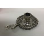 A Continental Antique silver candlestick of shaped