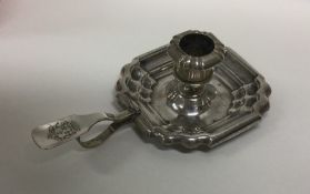 A Continental Antique silver candlestick of shaped