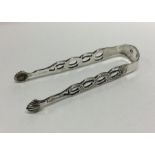 DUBLIN: A good pair of cast silver sugar tongs. By