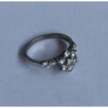 A good diamond daisy head cluster ring in 18 carat