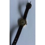 A lady's gold mounted wristwatch on leather strap.