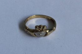 A 9 carat diamond set 'dearest' ring. Approx. 2 gr