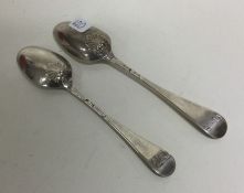 A matched pair of silver shell back teaspoons. Lon