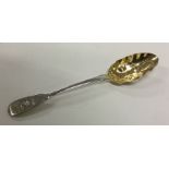 A novelty silver berry spoon with gilt bowl. Londo