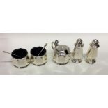 An Edwardian silver five piece cruet set. Birmingh