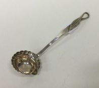 A small 18th Century silver cream ladle with leaf