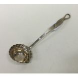 A small 18th Century silver cream ladle with leaf