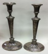 A pair of large tapering silver candlesticks. Birm