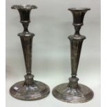 A pair of large tapering silver candlesticks. Birm