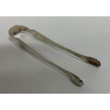 A pair of shaped Georgian silver sugar tongs. Lond