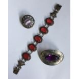 A bag containing Scottish silver brooch, bracelet